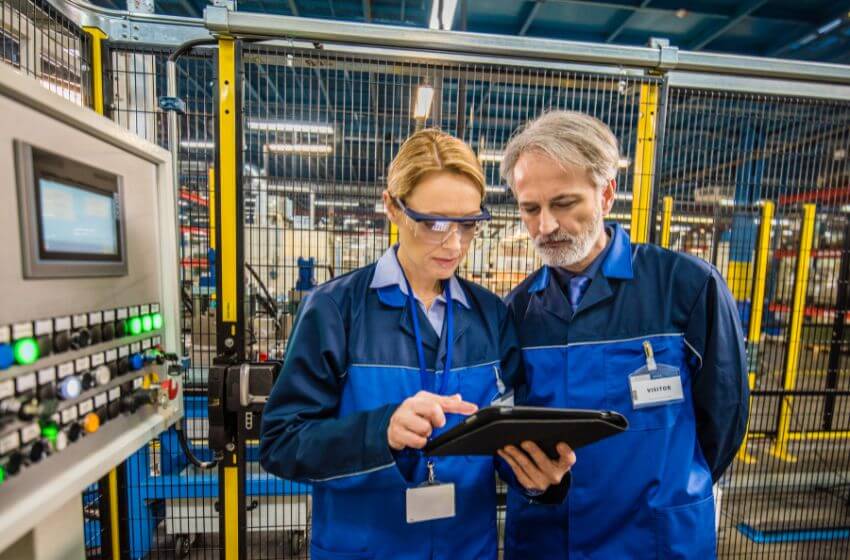 Image of two employees using a tablet